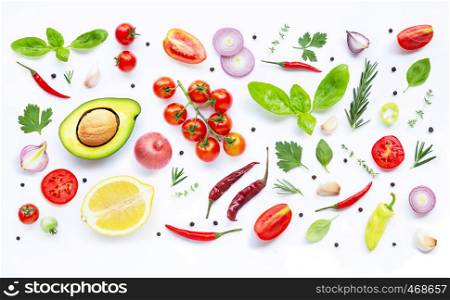 Various fresh vegetables and herbs on white background. Healthy eating concept.