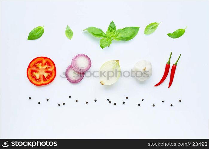 Various fresh vegetables and herbs on white. Healthy eating concept.