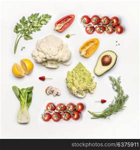 Various fresh vegetables ingredients on white background, top view, flat lay. Layout for Detox, dieting , clean eating and healthy food
