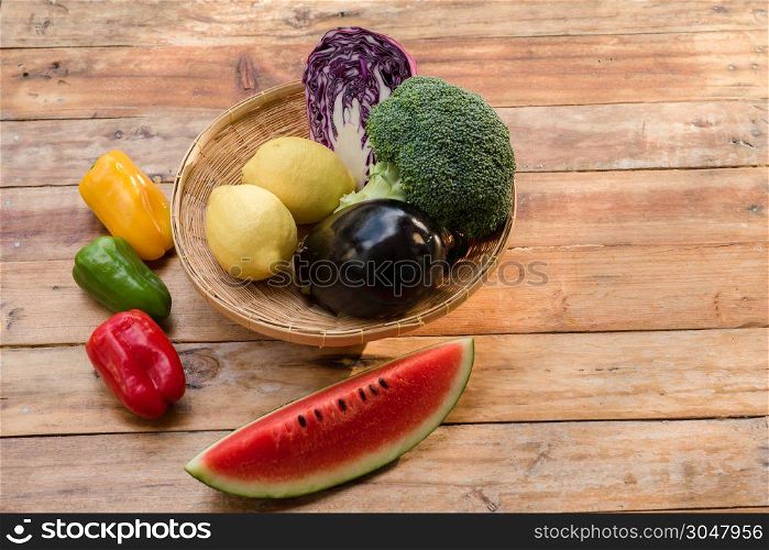 Various fruits with vegetable on wood background