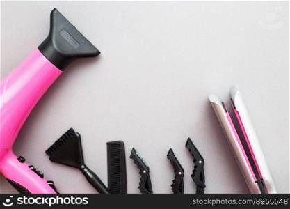 various hairdressing tools like hair dryer, comb on a gray background. beauty salon concept.. various hairdressing tools like hair dryer, comb on a gray background. beauty salon concept