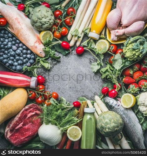 Various healthy organic balanced food ingredients : vegetables, fishes, meat, chicken,fruits and berries, juices drinks on gray concrete background , top view, frame. Clean diet food concept