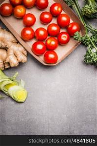 Various healthy vegetarian ingredients on gray stone background , top view, border