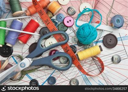 various items for needlework on the background pattern