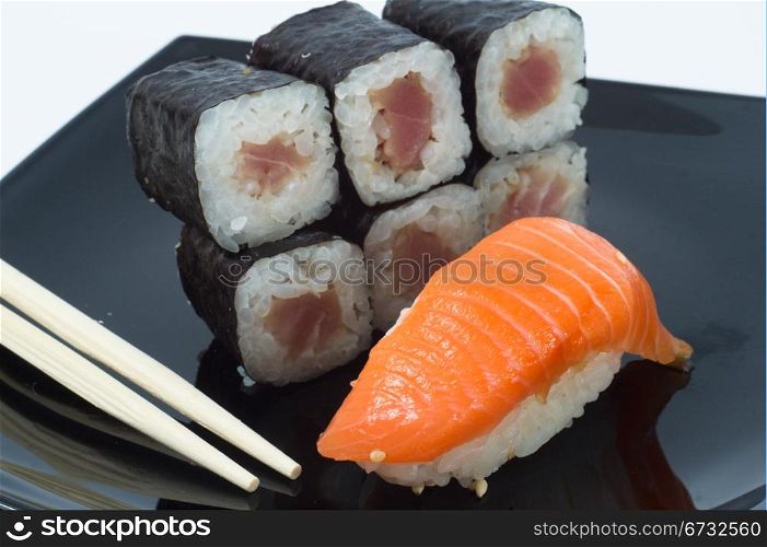 Various kinds of sushi and sashimi. Isolated.