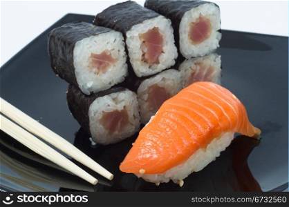 Various kinds of sushi and sashimi. Isolated.