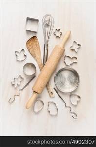 various kitchen bake utensils on white wooden table, top view