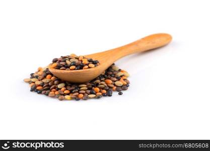 Various lentils mix on a white background in a wooden spoon