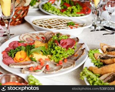 Various meat slices on white plate - collation
