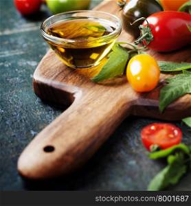 various of colorful tomatoes on wooden background. Cooking, Healthy Eating or Vegetarian concept