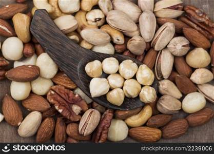 various organic nuts snack spoon background