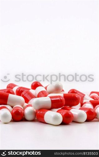 Various oval medicine pills on white background with free space. Various oval pills on white background