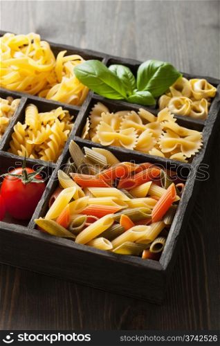 various pasta in black wooden box