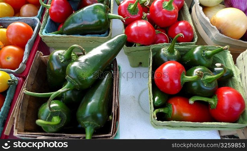 Various peppers on display at a farmer&acute;s market.