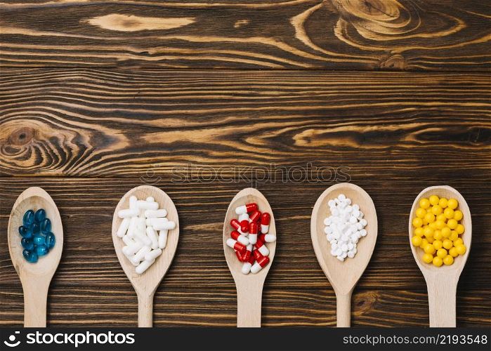 various pills wooden spoon