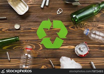 various reusable trash around recycling symbol. High resolution photo. various reusable trash around recycling symbol. High quality photo