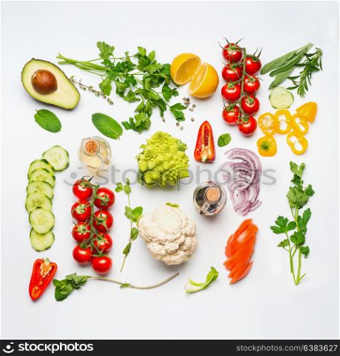 Various salad vegetables ingredients on white background, top view, flat lay. Healthy clean eating or diet food concept.