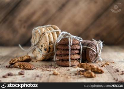 various shortbread, oat cookies, chocolate chip biscuit on rustic wooden background.. shortbread, oat cookies, chocolate chip biscuit on wooden background.