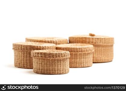 Various Sized Wicker Baskets Isolated on White - Focus is on the Front Small Basket.