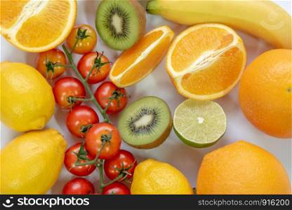 Various sliced fruits on white background. Close up of nutrition vitamin c fruits. Healthy and freshness food concept. Top view and flat lay theme.