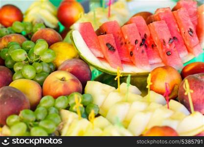 Various slices of fruits on the mirror stand prepared for eating
