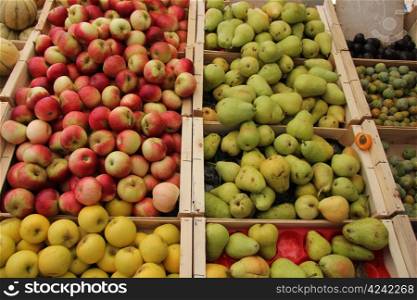 Various sorts of apples and pears at a Provencal market in France
