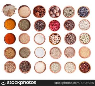 Various spices in wood bowl isolated on white. Big set. Spice set isolated
