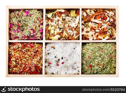 various spices on wooden box isolated on white background