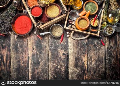 Various spicy spices and herbs. On a wooden background.. Various spicy spices and herbs.