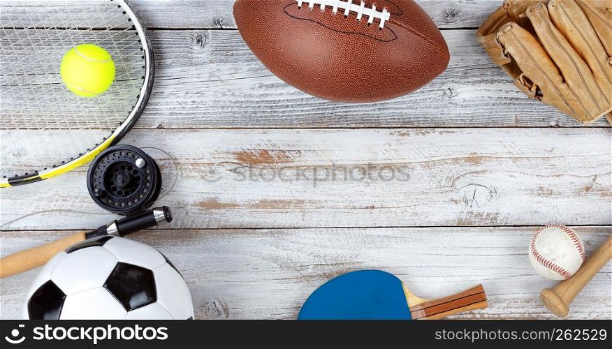 Various sporting equipment on white rustic wood