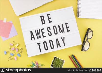 various stationeries with be awesome today text yellow background