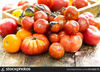 various tomatoes on a wooden table