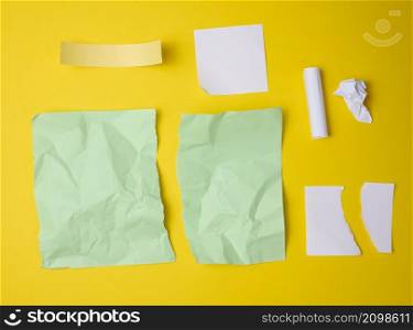 various torn pieces of paper on yellow background, set