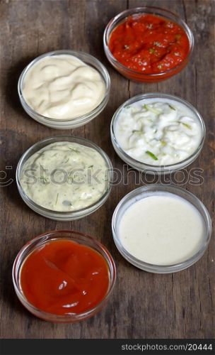 various type of sauces on old wood