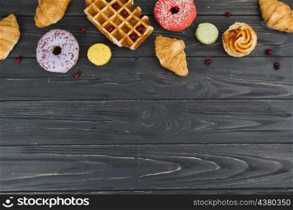 various type sweets baked items wooden table