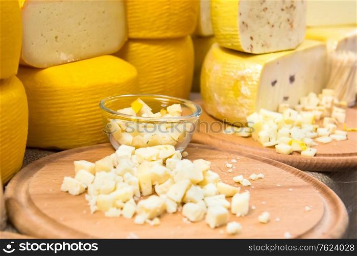Various types of cheese on wooden desk
