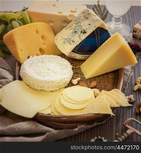 Various types of cheese set. Various types of cheese set with grapes and nuts