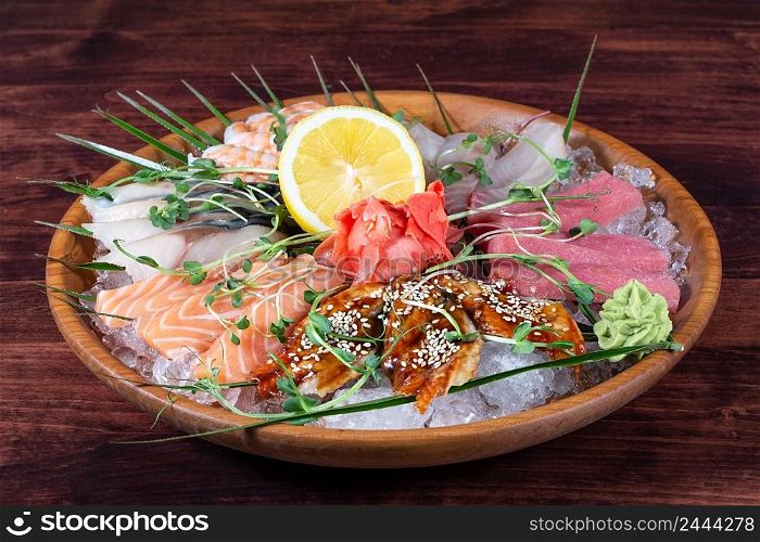 Various types of fish on a plate with ice and lemon. Various types of fish on plate with ice and lemon