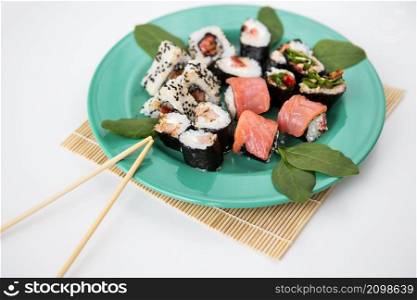 Various types of maki sushi, philadelphia, maki, salmon, rice, salad Delicious and healthy food. Various types of maki sushi, philadelphia, maki, salmon, rice, salad. Delicious and healthy food.