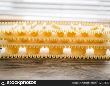 Various types of pasta on lasagne sheets