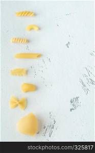 Various types of pasta on the white background