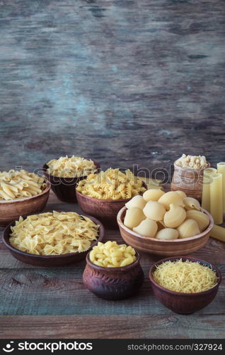 Various types of pasta on the white background