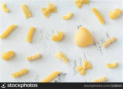 Various types of pasta on the white background