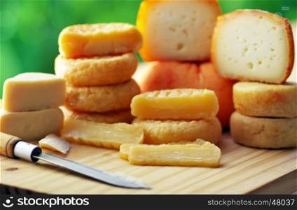 Various types of portuguese cheese on table