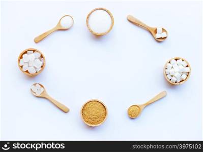 Various types of sugar on white background.