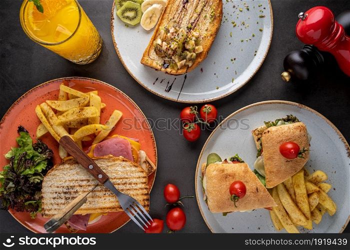 Various types of toast and sandwiches on stone table