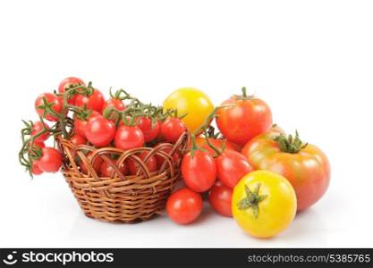 Various types of tomatoes isolated on white background