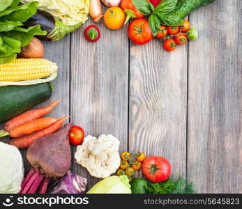 Various vegetables on a wooden table with copy space