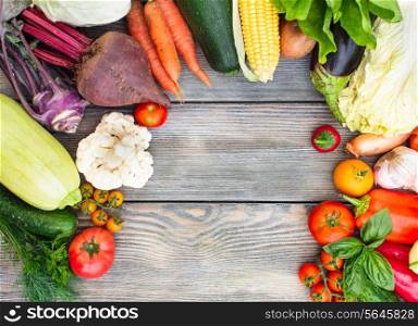 Various vegetables on a wooden table with copy space