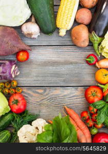 Various vegetables on a wooden table with copy space